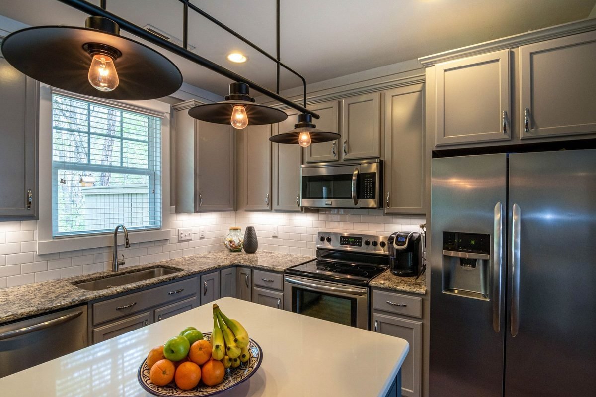 bowl of fresh fruit on a kitchen island in a modern kitchen