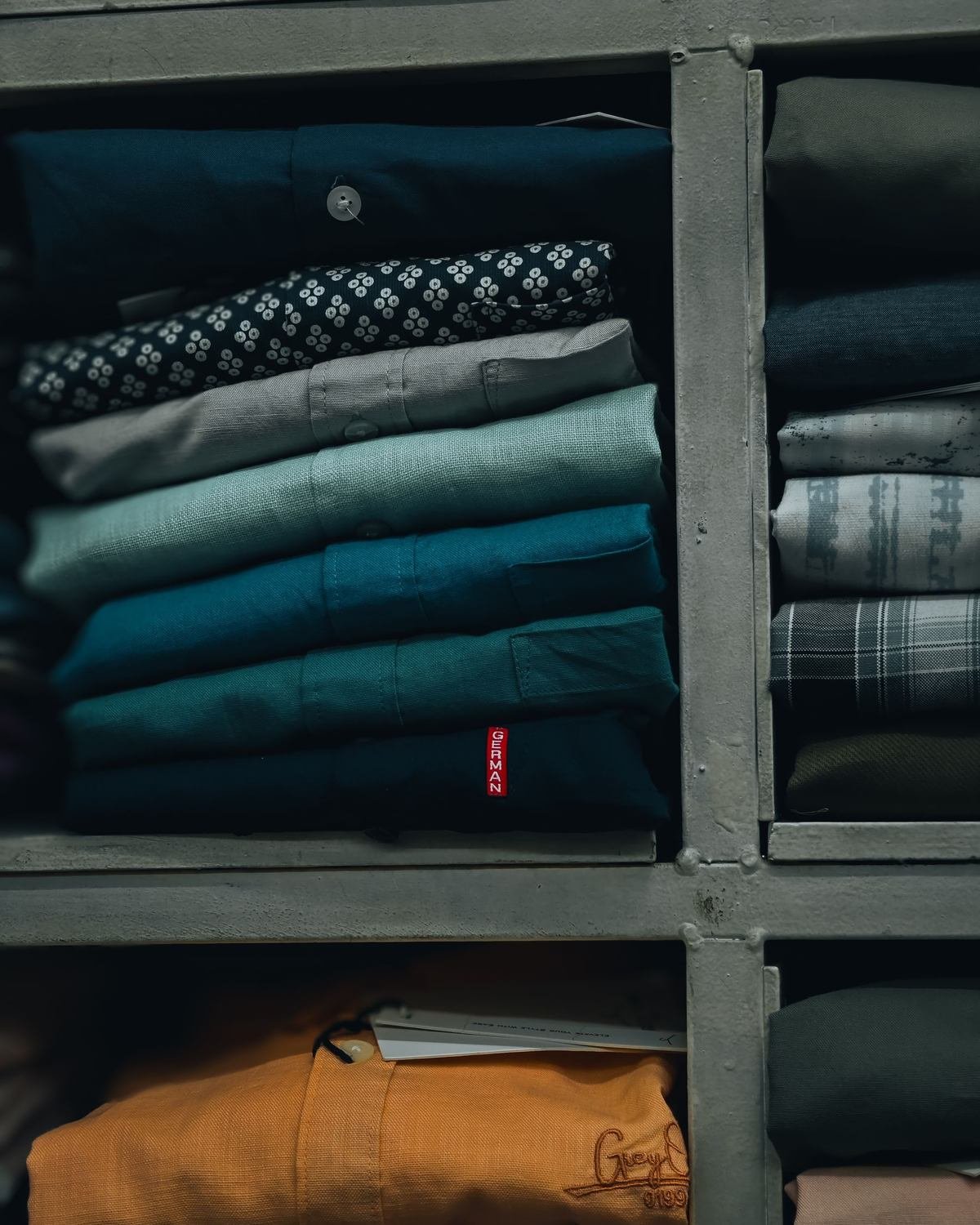 drawer dividers holding neatly file-folded clothes
