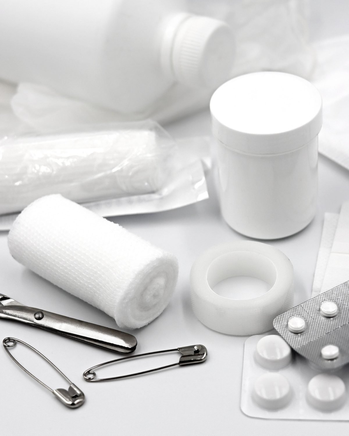 first aid supplies laid out on a light surface