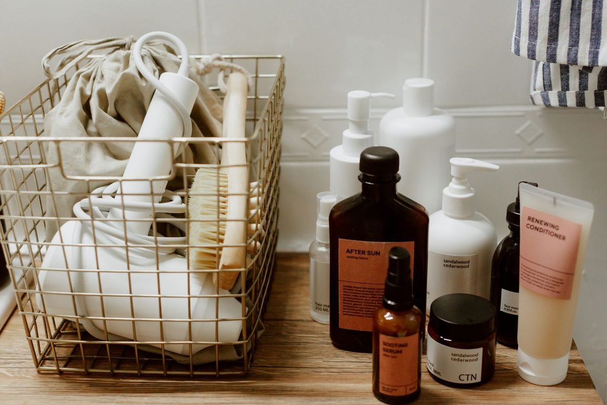 hair tools and brushes stored upright in a tall basket
