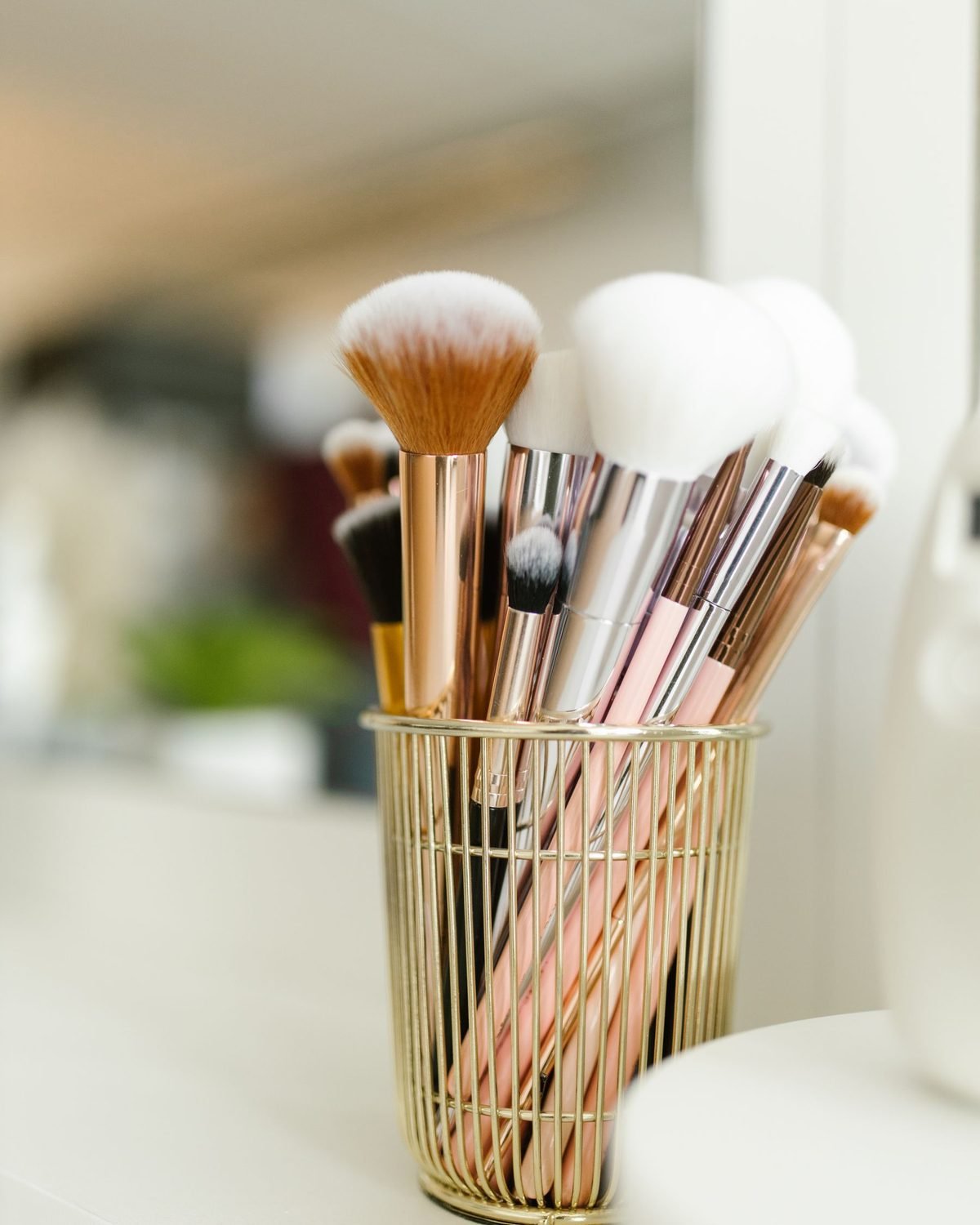makeup brushes standing upright in a container