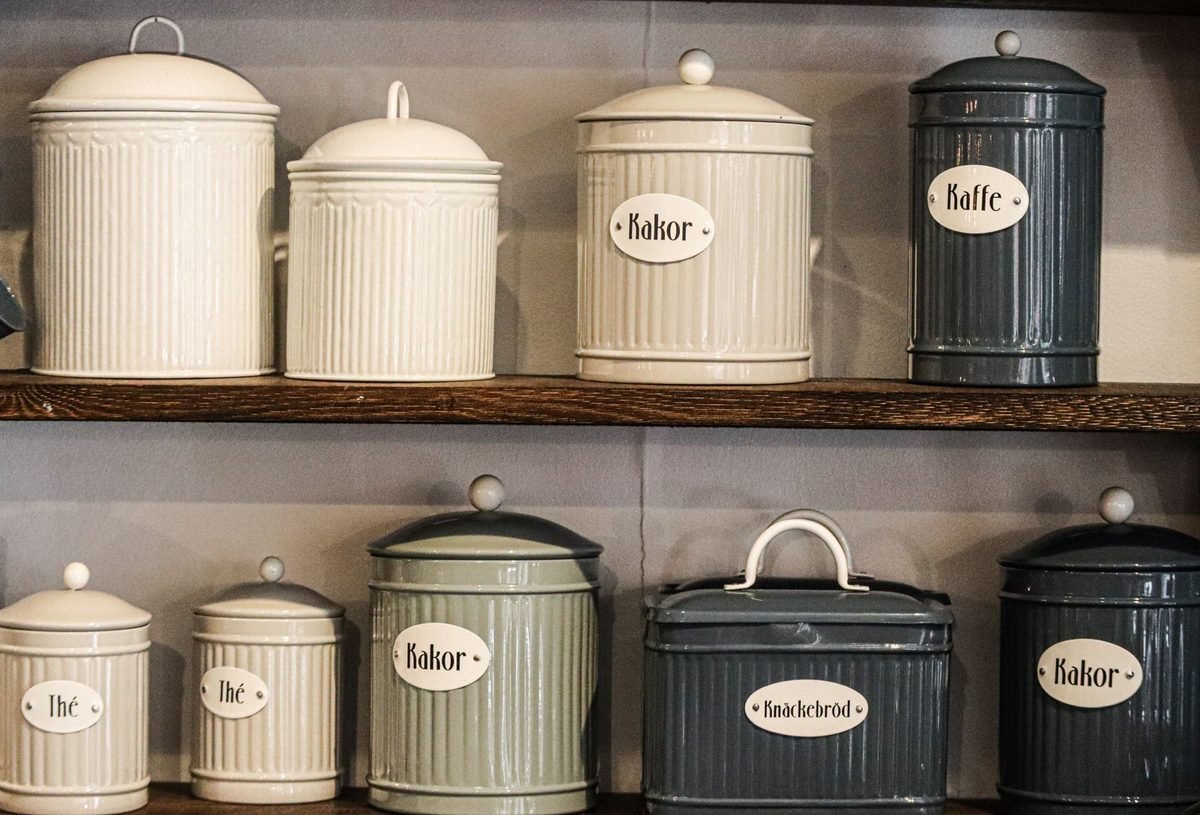 matching kitchen containers of dry goods lined up on shelves