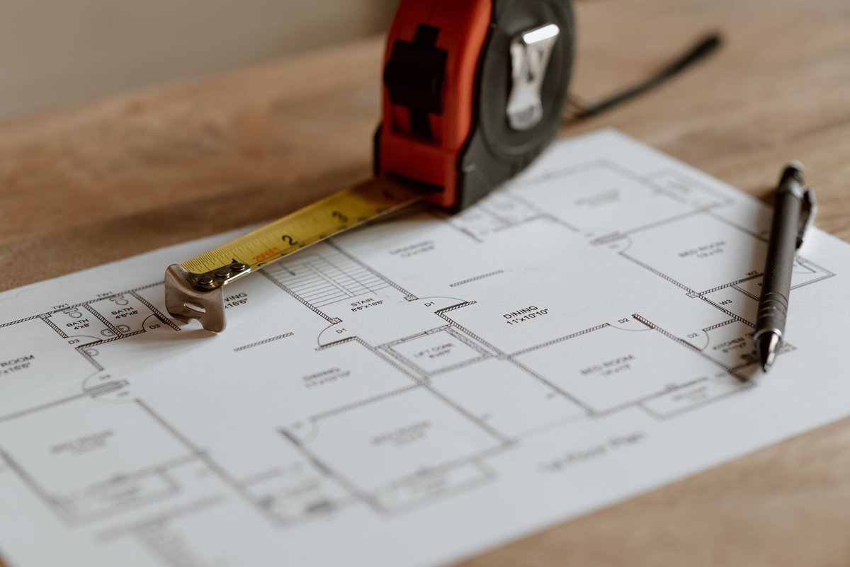 tape measure and floor plan for measuring small apartment storage space