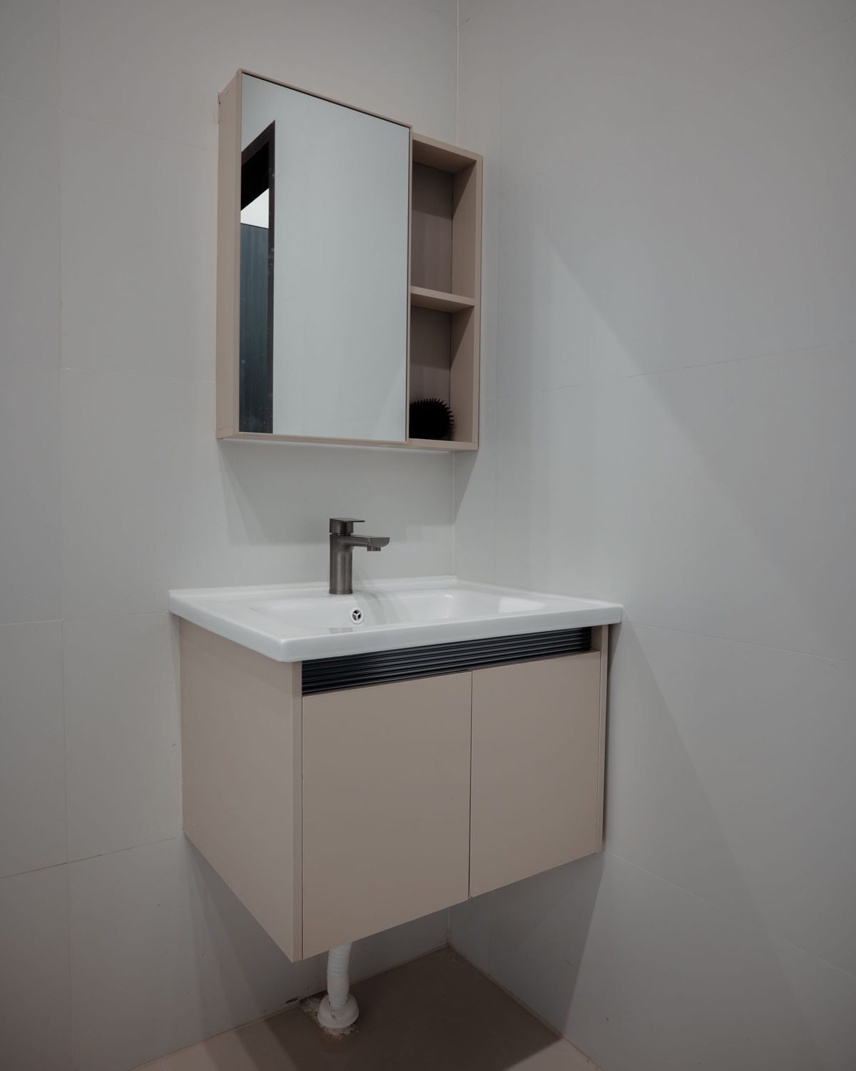small wall-mounted bathroom vanity cabinet with a mirror cabinet above