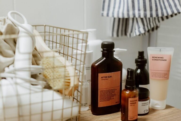 under bathroom sink organization ideas: wire basket and skincare bottles in a bathroom corner