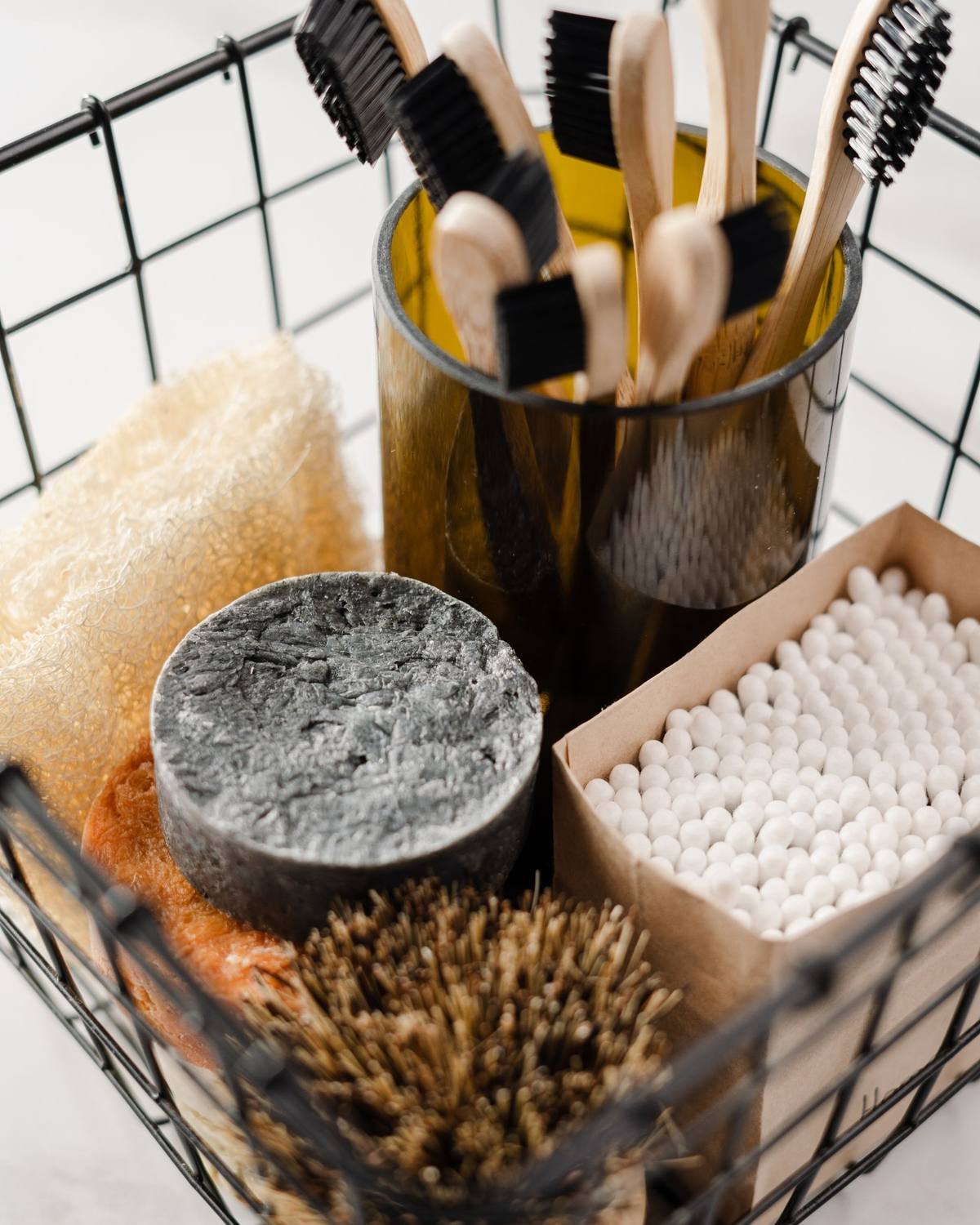 wire basket holding toiletries for cheap bathroom organization